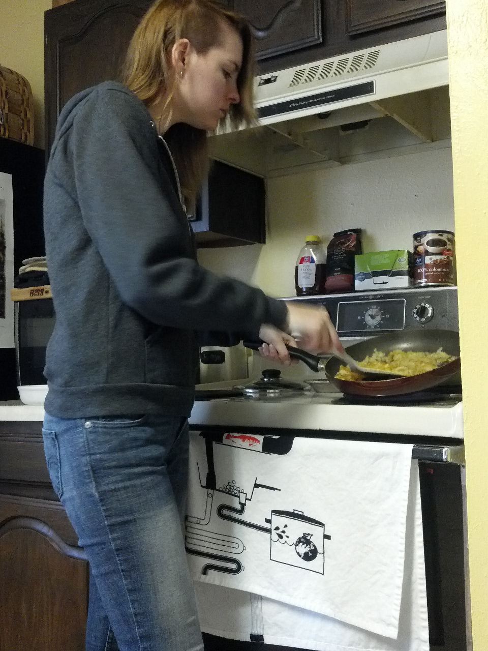 12 pm. Cooking hashbrowns for a casserole sort of thing for tommorrow. I also assembled pumpkin cinnamon rolls that you can't see here. Dressing slobby.