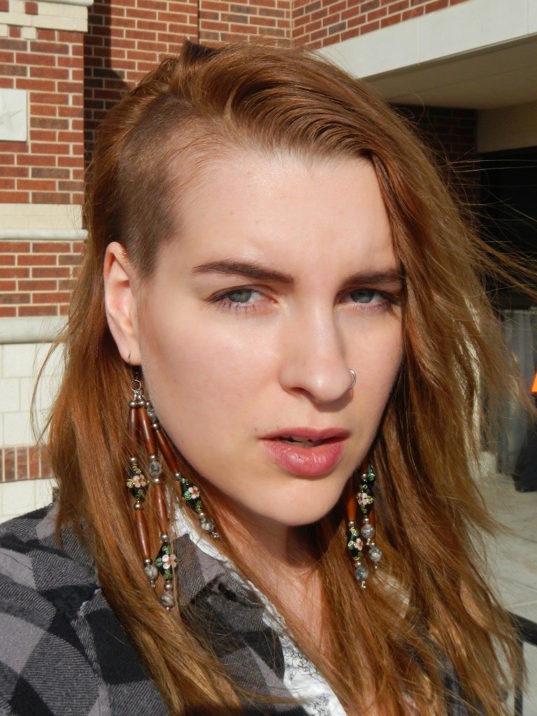 I made the earrings from horn pipe and cloisonne beads. I like the mix of styles. The side shave makes wearing earrings more appealing.