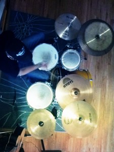 5pm - Watching Thom play drums from the stair landing. 