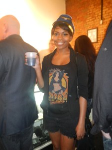 I regret that I could not get back far enough to get the full outfit. She was also wearing combat boots and sheer trouser socks. 