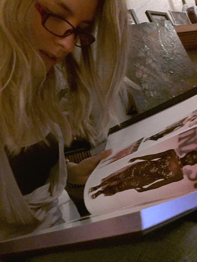 Using glasses to read fashion books.