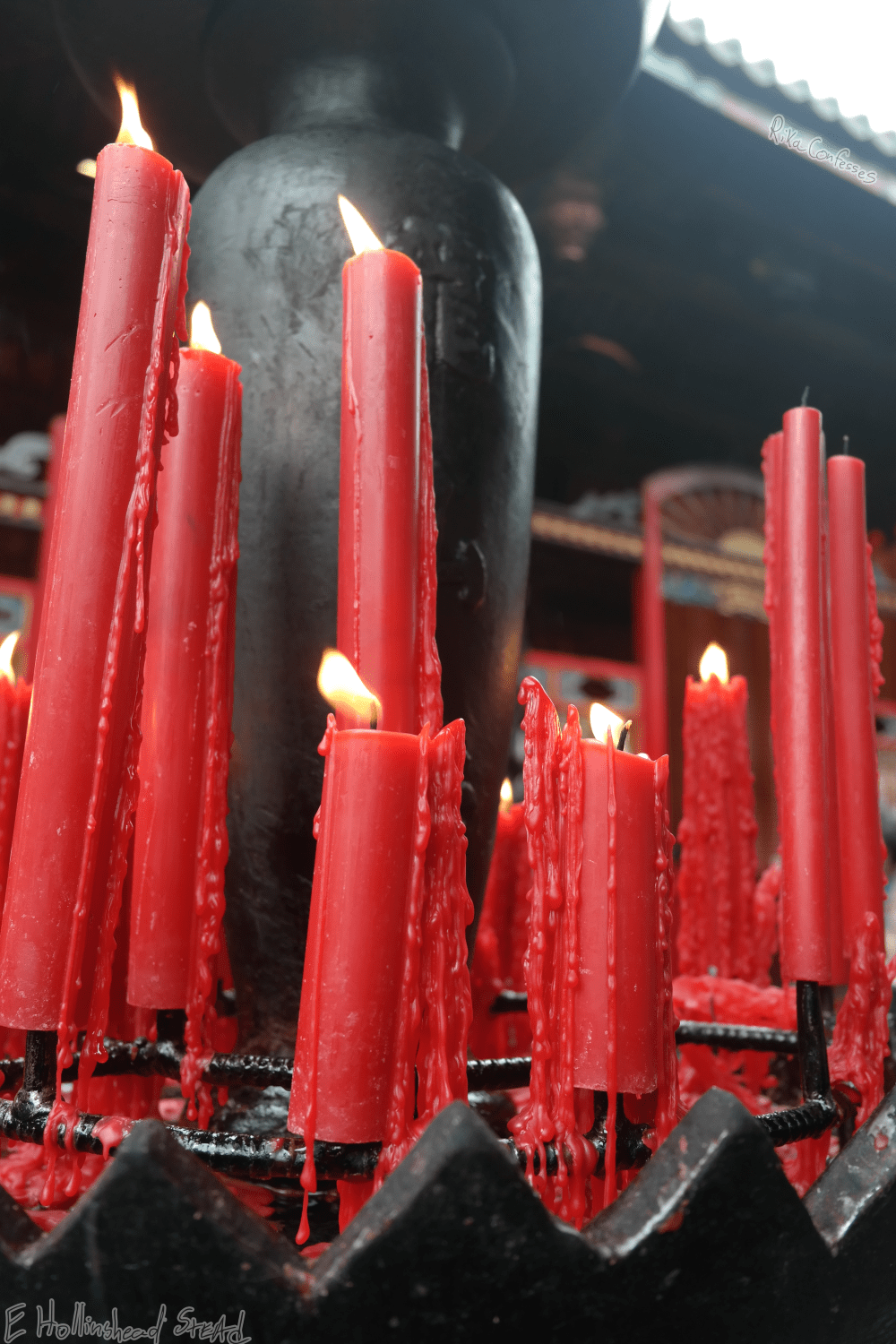 red candles lit in centerpiece at Lungshun Temple in taiwan